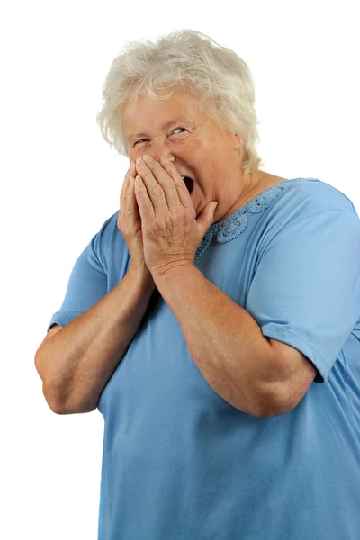 A senior woman sneezes — Stock Photo, Image