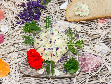 Delicious herb butter with bread clipart