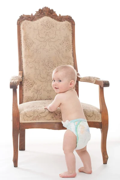 Baby boy on the antique chair Stock Photo