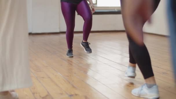 Close-up shot of dancers legs learning dance step in studio — Stock Video