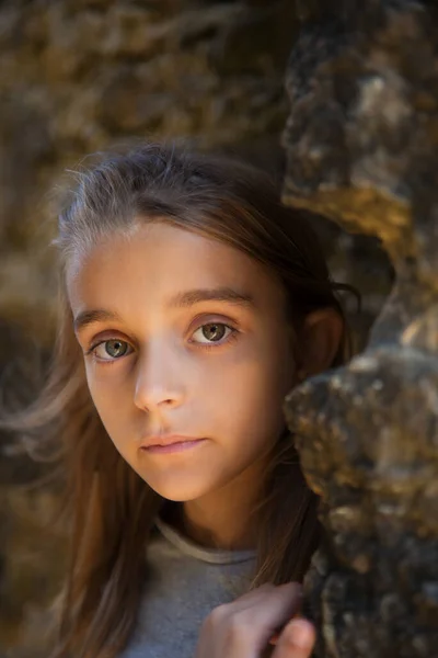 Portrait of serious little girl in old castle — Stock Photo, Image