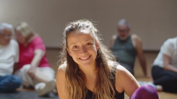Medium shot of cheerful female dance teacher in ballroom — Stock Video