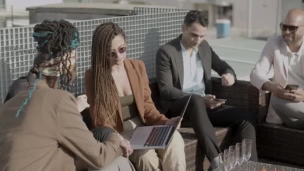 Slow motion of serious coworkers talking during outdoor party — Stock Video