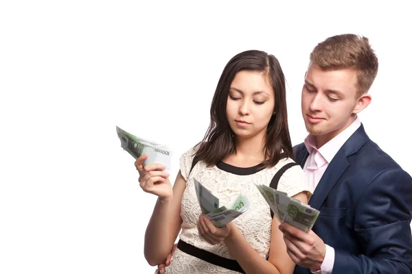 Man en vrouw met geld in handen — Stockfoto