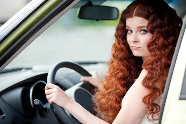 Woman sitting in car — Stock Photo, Image