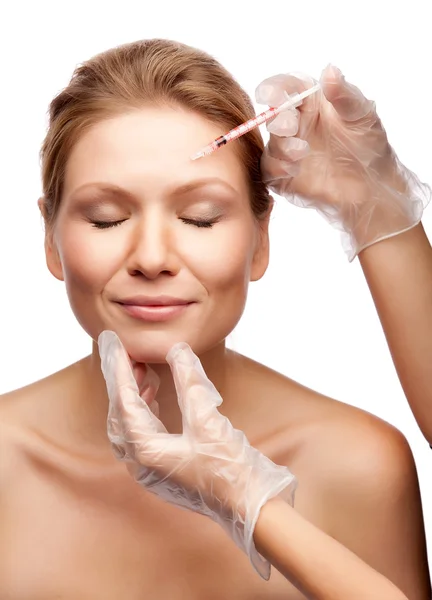 Beautiful woman gets an injection in her face — Stock Photo, Image