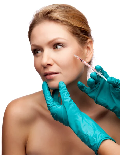 Beautiful woman gets an injection in her face — Stock Photo, Image