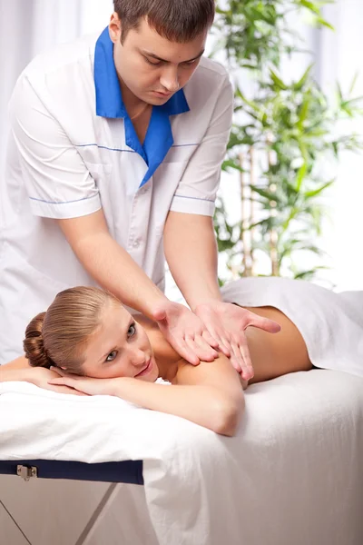 Masseur is massaging female — Stock Photo, Image