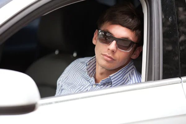 Young man in a car — Stock Photo, Image