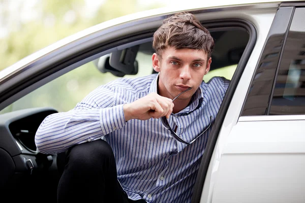 Young man in a car — Stock Photo, Image
