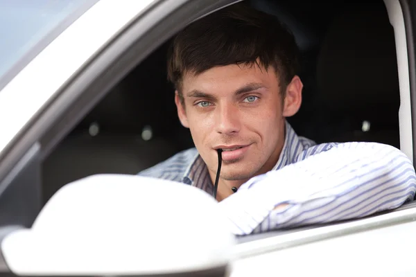 Young man in a car — Stock Photo, Image