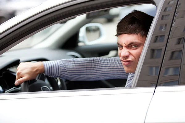 Young man in a car — Stock Photo, Image