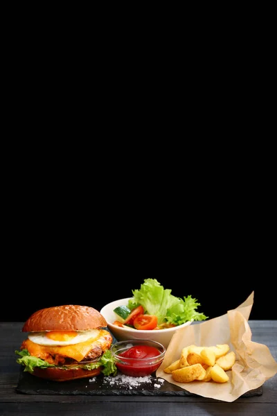 Burger Egg Fries Ketchup Sauce Wooden Table Black Background Tasty — Stock Photo, Image