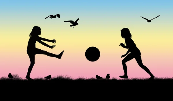 Silhouet van twee meisjes spelen met een bal — Stockfoto