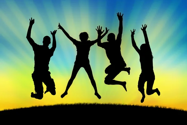 Happy jumping in joy on a sunset background — Stock Photo, Image