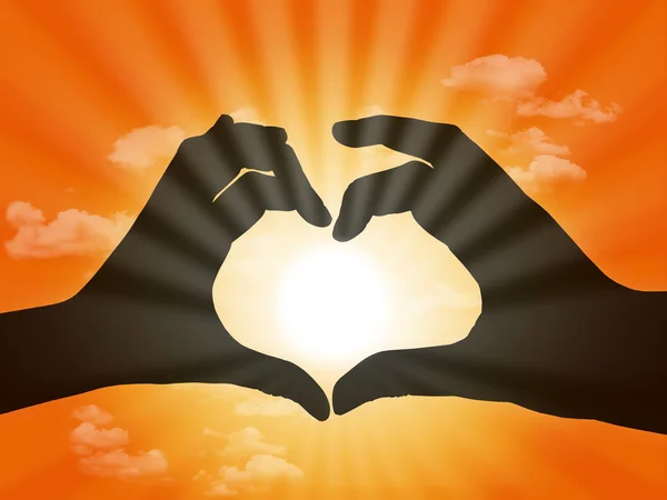 Heart made with fingers on sunset background — Stock Photo, Image