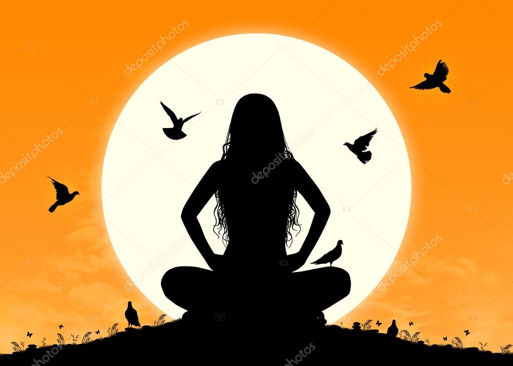 Young woman in meditation at sunrise