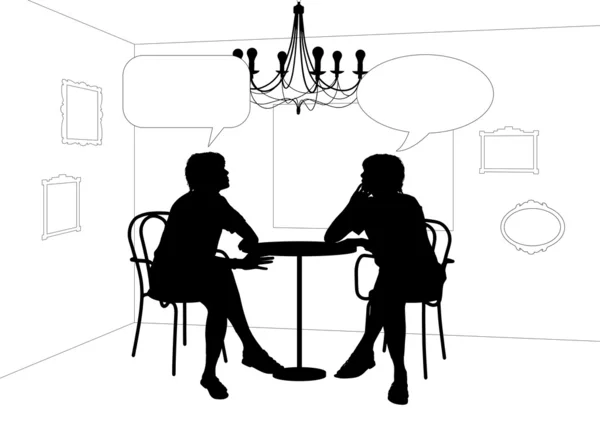 Two women speaking at the table in cafe — Stock Photo, Image