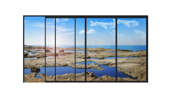 Ventana panorámica moderna con un paisaje de piedras y mar —  Fotos de Stock