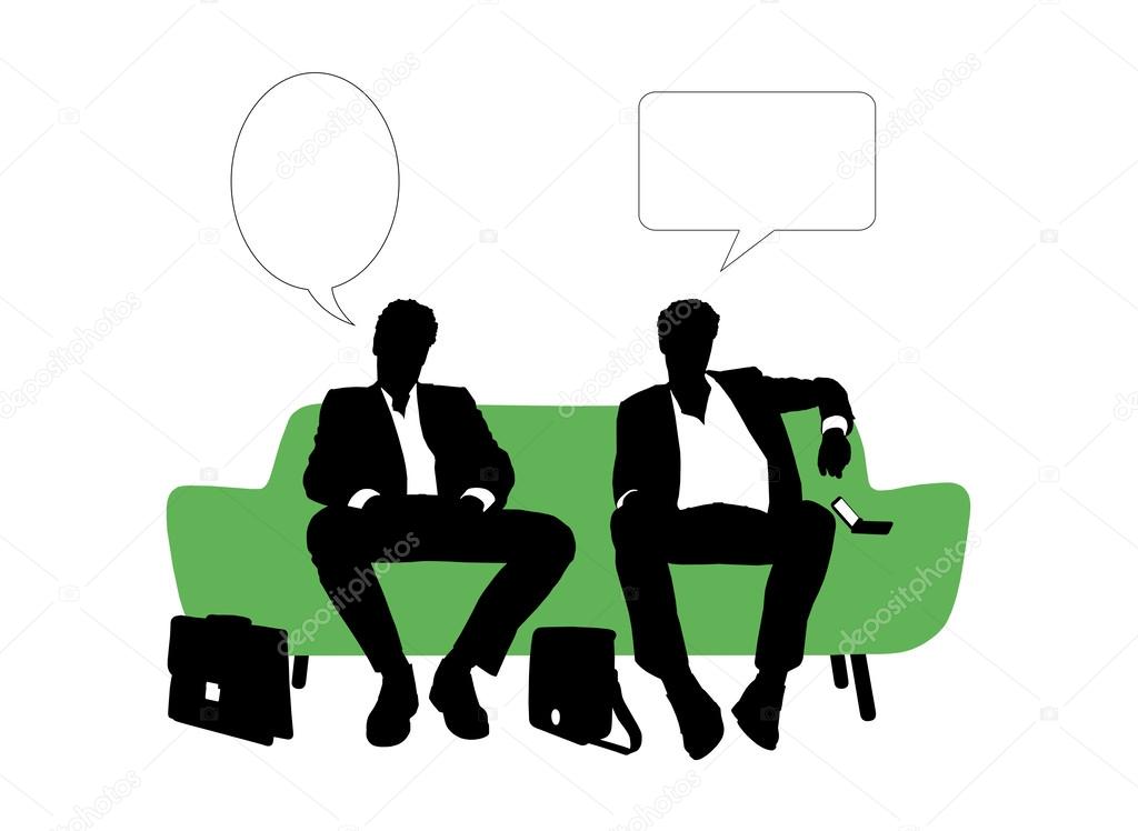 Two businessmen speaking seated on green sofa