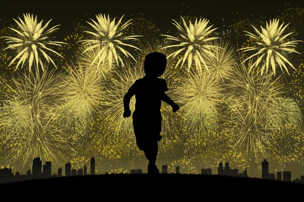 Little boy running towards golden fireworks — Stock Photo, Image