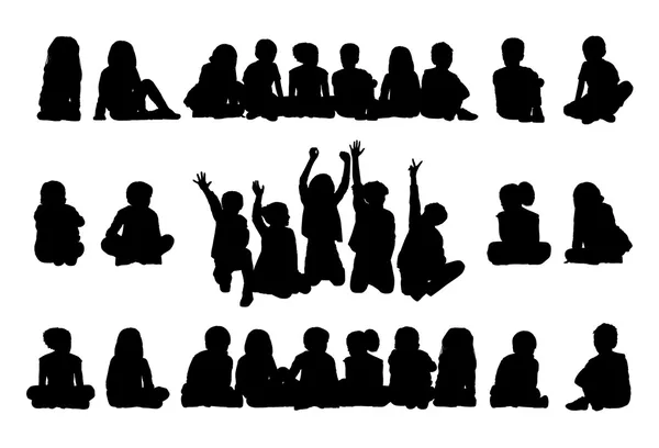 Big set of schoolchildren seated silhouettes — Stock Photo, Image