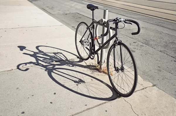 Bicycle locked up on the street in Toronto — Stock Photo, Image