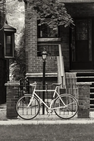 Bicycle parked near steel fence — Stock Photo, Image