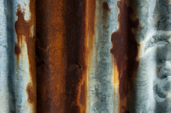 Rusty and distorted galvanized iron background — Stock Photo, Image