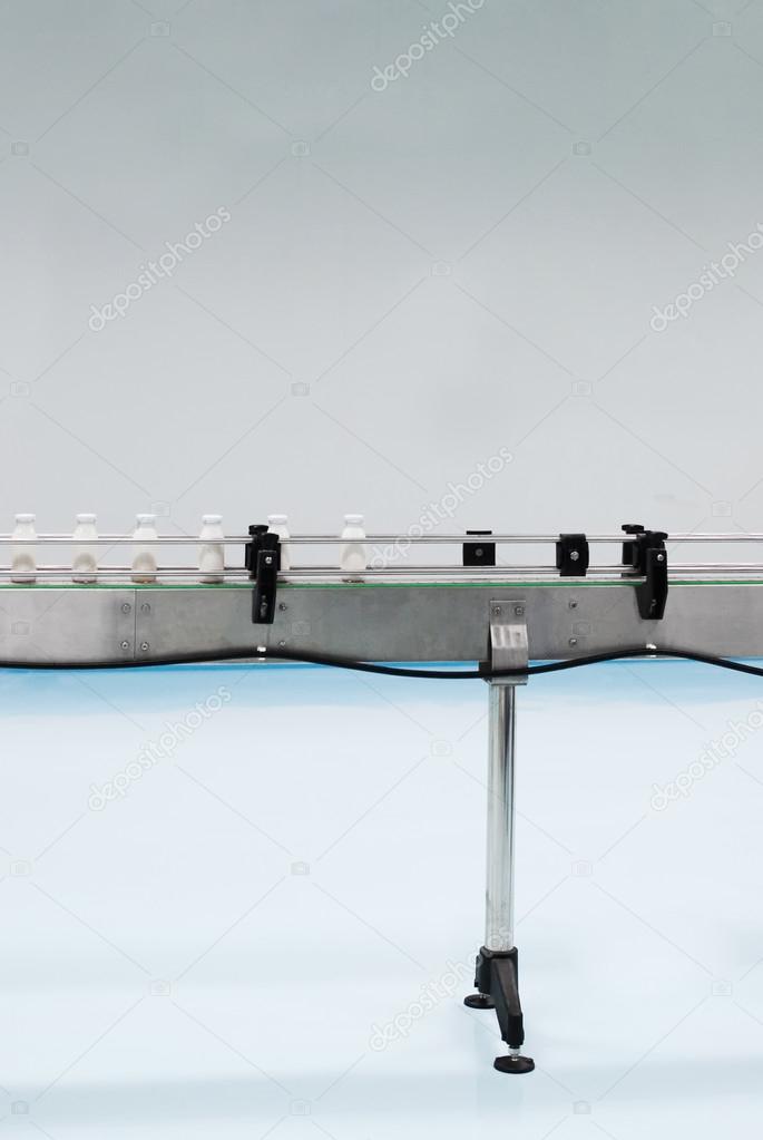 Glass bottles on the conveyor belt