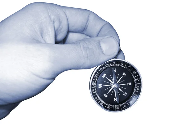 Kompass i hand geografiskt isolerade tonen — Stockfoto