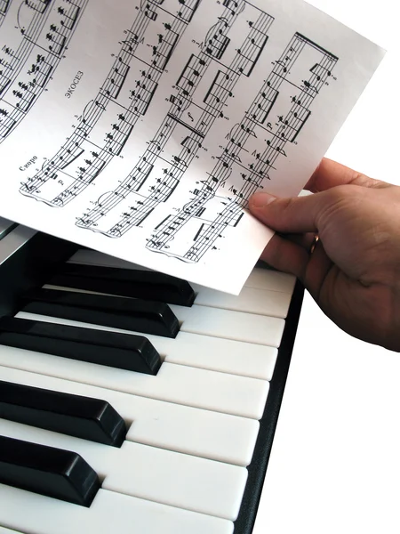 Piano music with hand — Stock Photo, Image