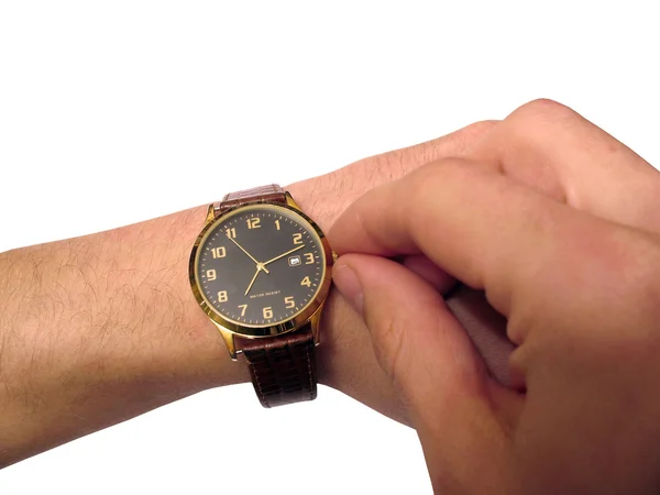 Armbanduhr an der Hand isoliert lizenzfreie Stockfotos