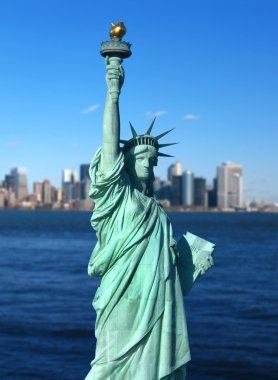 New York: The Statue of Liberty, an American symbol, with Lower Manhattan skyline in the background. Tourism concept photo. Liberty Island, New York City, USA