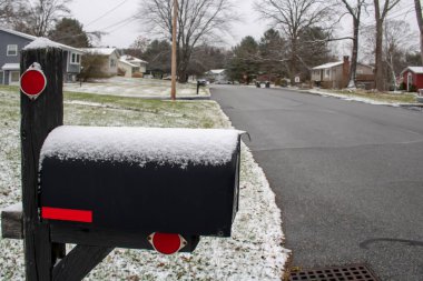 snow coverd street urban mailbox