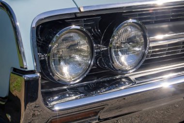 close up of classic vintage aesthetic car front lights, grille, 