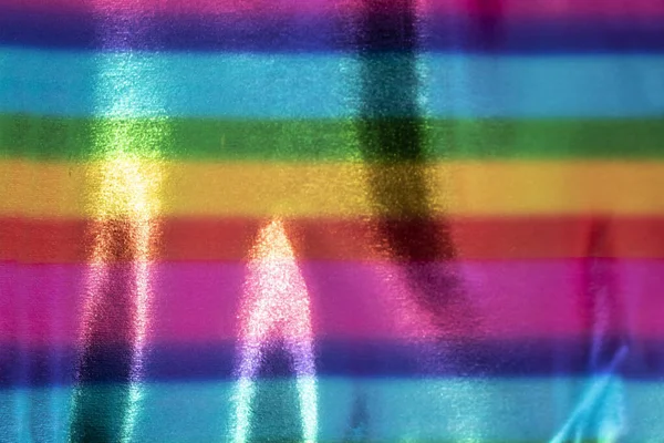 Fun Horizontal rainbow lines of color on shinny surface