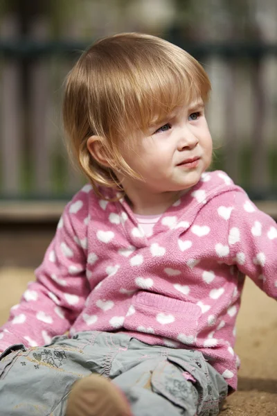 Little girl outside on playground playing with her mother — Stock Photo, Image