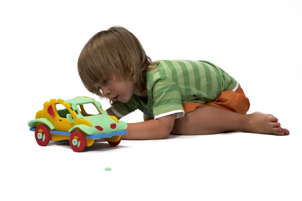 Chlapec při hře s nastavenou gumovou pěnou hračky — Stock fotografie