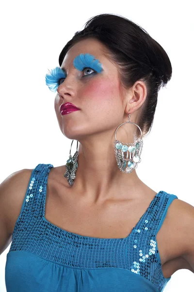 Lady posing in studio for portrait with blue feather eye lashes — Stock Photo, Image