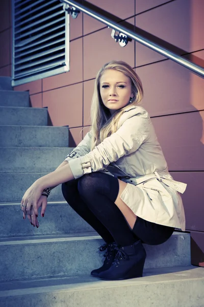 Young blonde beautiful lady on city stairs posing for beauty shots — Stock Photo, Image