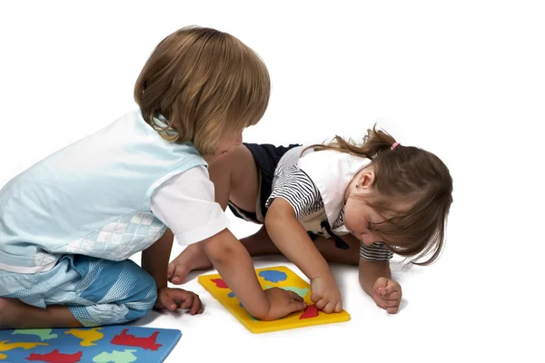 Children at play with set of rubber foam toys — Stock Photo, Image