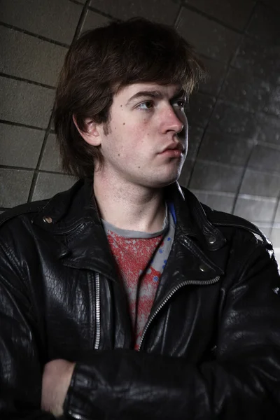 Young man posing on various city industrial locations — Stock Photo, Image