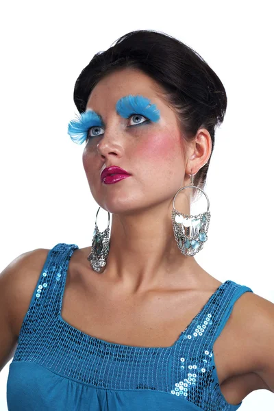 Lady posing in studio for portrait with blue feather eye lashes — Stock Photo, Image