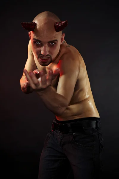Man posing in styling of devil — Stock Photo, Image