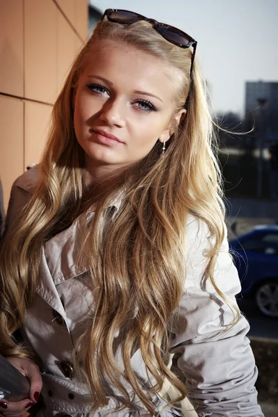 Young blonde beautiful lady on city stairs posing for beauty shots — Stock Photo, Image