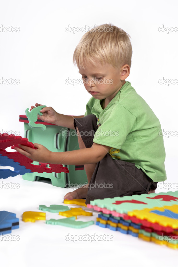 Children at play with set of rubber foam toys