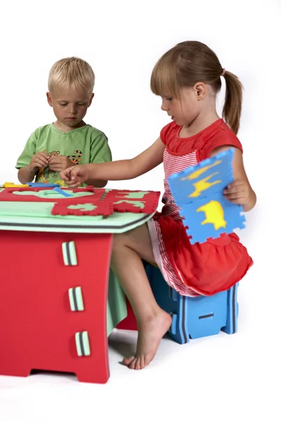 Children at play with set of rubber foam toys — Stock Photo, Image