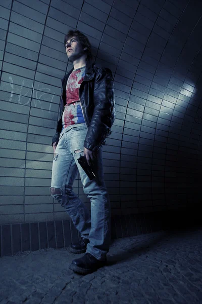 Young man posing on various city industrial locations — Stock Photo, Image