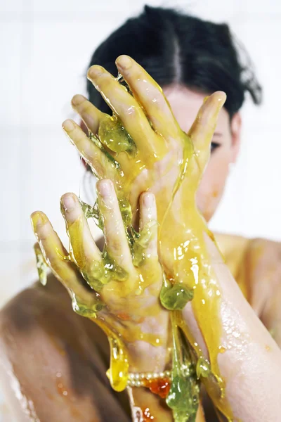 Young woman playing with melted Jelly — Stock Photo, Image